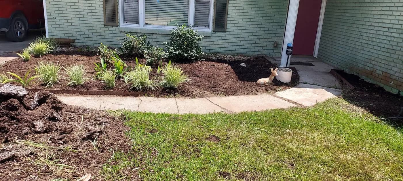 Freshly worked bed along a front walkway